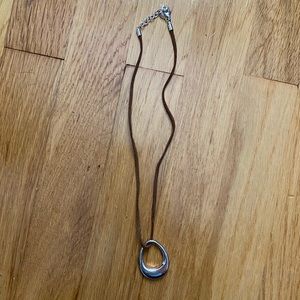 silver drop necklace with black and brown bands